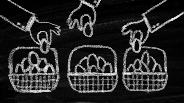 drawing of hands putting eggs in a basket on a chalkboard